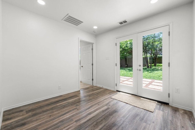 7309 Blessing Ave, Austin, TX 78752 - spare room featuring french doors, wood finished floors, and recessed lighting