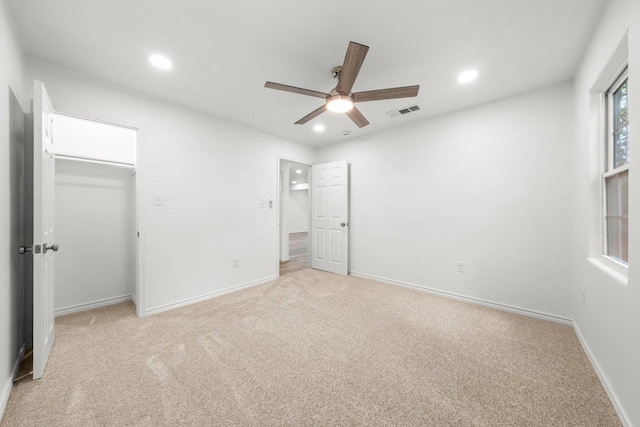 7309 Blessing Ave, Austin, TX 78752 - unfurnished bedroom featuring light carpet, recessed lighting, a ceiling fan, and a spacious closet
