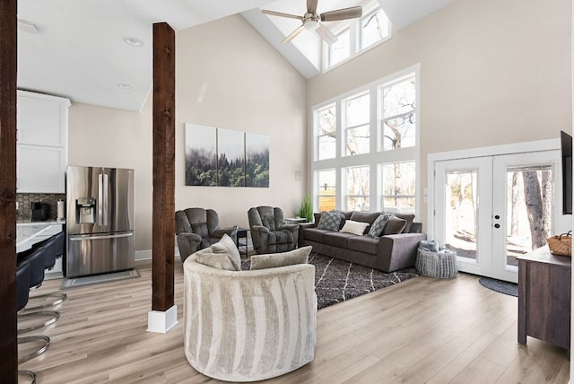 TBD Fm 3000, Elgin, TX 78621 - living room featuring a high ceiling, a ceiling fan, light wood-style flooring, and french doors