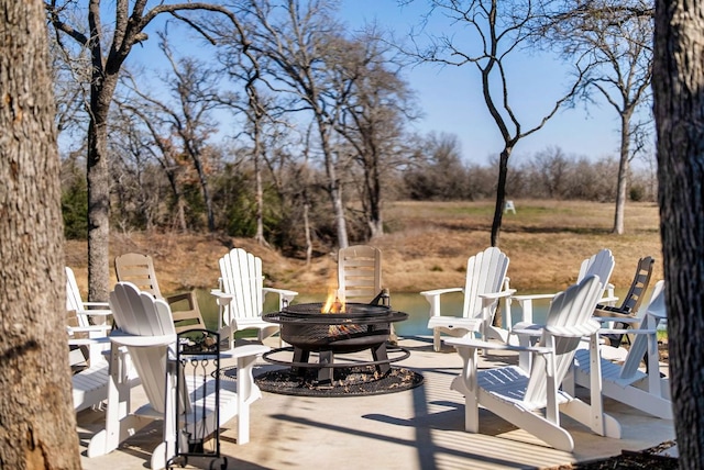 TBD Fm 3000, Elgin, TX 78621 - view of patio featuring an outdoor fire pit and view of scattered trees