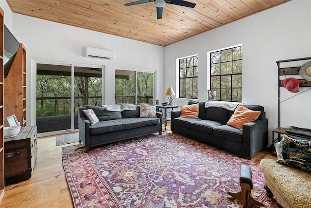 415 Balch Rd, Elgin, TX 78621 - living area with ceiling fan, wooden ceiling, light wood-style flooring, and a wall mounted air conditioner