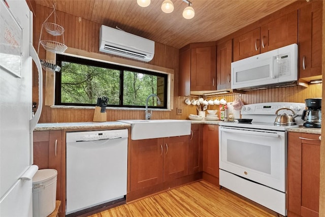 415 Balch Rd, Elgin, TX 78621 - kitchen featuring white appliances, a wall mounted AC, light countertops, light wood-type flooring, and wooden ceiling