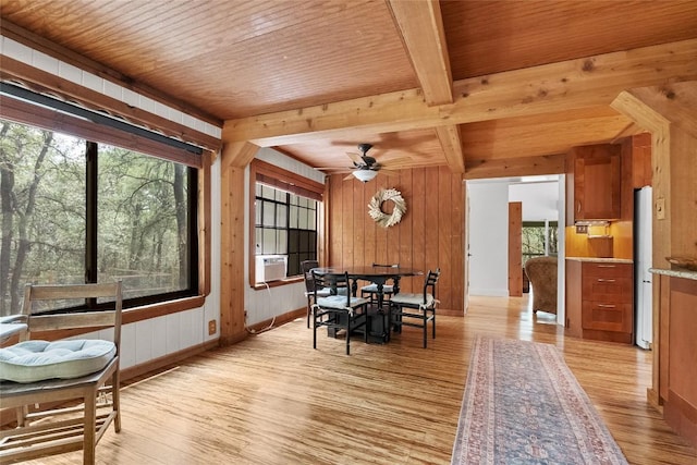 415 Balch Rd, Elgin, TX 78621 - dining room featuring light wood-type flooring, a ceiling fan, wood walls, a wood ceiling with exposed beams, and cooling unit