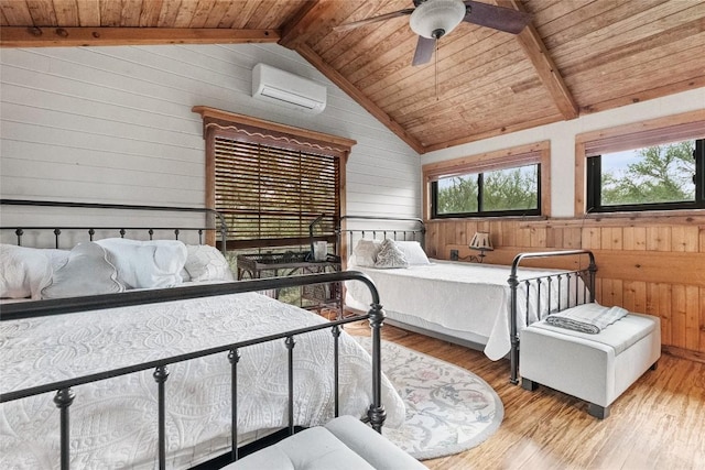 415 Balch Rd, Elgin, TX 78621 - bedroom with a wall unit AC, wood ceiling, wood walls, wood finished floors, and ceiling fan