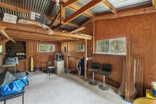 415 Balch Rd, Elgin, TX 78621 - misc room featuring wooden walls, a wall mounted AC, and concrete flooring