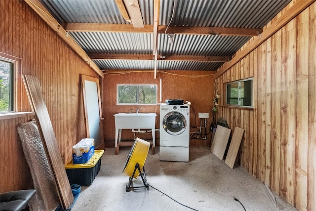 415 Balch Rd, Elgin, TX 78621 - laundry area with washer / dryer and wood walls