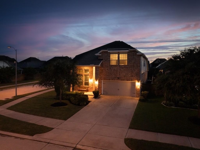 24822 Levante Dr, Richmond, TX 77406 - traditional-style house featuring a garage, concrete driveway, brick siding, and a yard