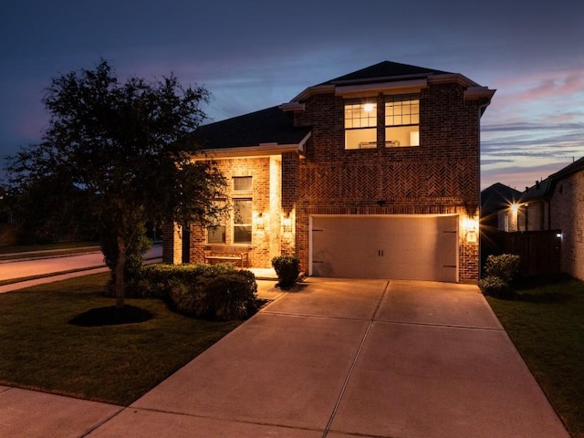 24822 Levante Dr, Richmond, TX 77406 - traditional-style house featuring concrete driveway, brick siding, and an attached garage