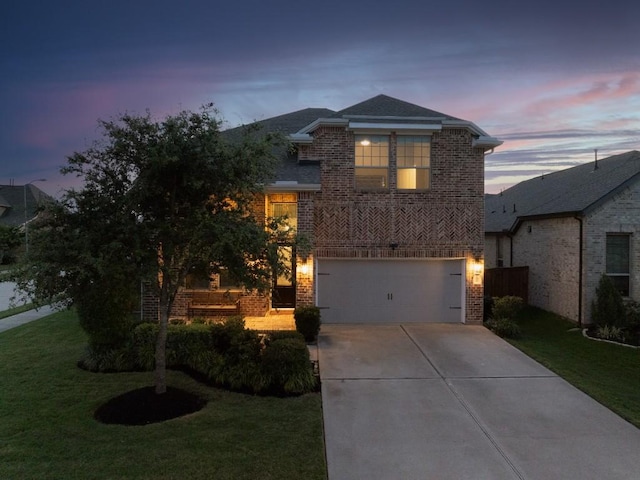 24822 Levante Dr, Richmond, TX 77406 - traditional-style home featuring brick siding, concrete driveway, a front lawn, and a garage
