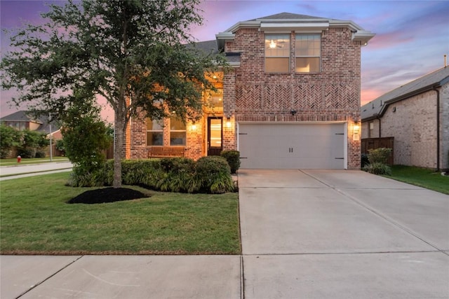 24822 Levante Dr, Richmond, TX 77406 - view of front of property with brick siding, concrete driveway, a garage, and a front yard
