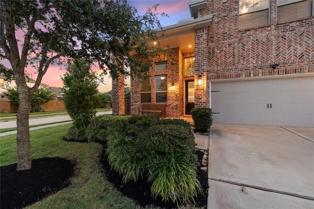 24822 Levante Dr, Richmond, TX 77406 - view of front of home with brick siding, concrete driveway, and a front yard
