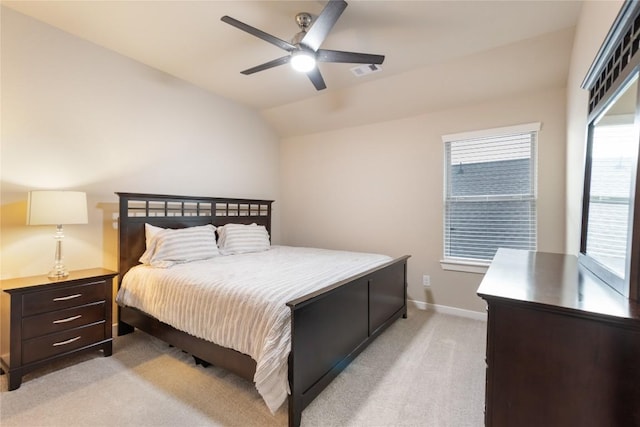 24822 Levante Dr, Richmond, TX 77406 - bedroom with light carpet, vaulted ceiling, multiple windows, and ceiling fan