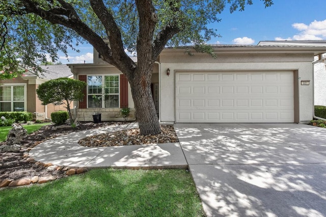 321 Summer Rd, Georgetown, TX 78633 - view of front of house with concrete driveway, a garage, and stucco siding