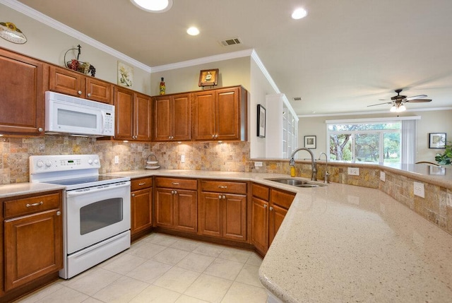 321 Summer Rd, Georgetown, TX 78633 - kitchen with white appliances, crown molding, brown cabinets, backsplash, and light tile patterned floors