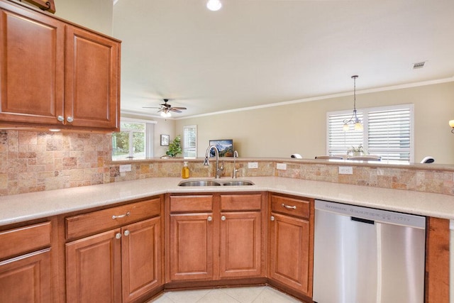 321 Summer Rd, Georgetown, TX 78633 - kitchen with stainless steel dishwasher, brown cabinets, a ceiling fan, ornamental molding, and light countertops