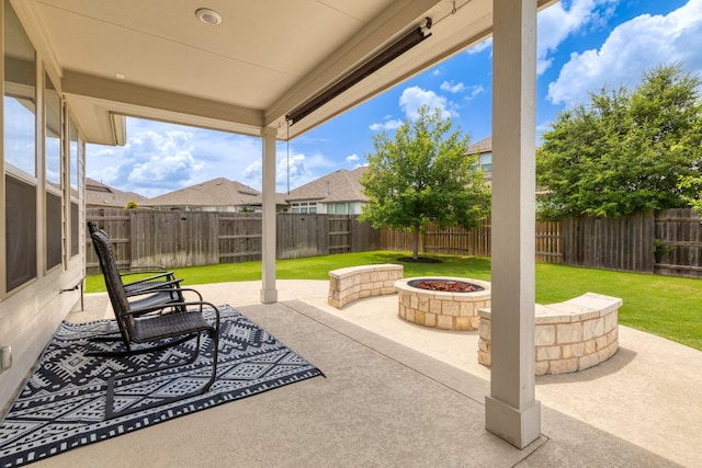 232 Silver Pass, Kyle, TX 78640 - fenced backyard with an outdoor fire pit and a patio