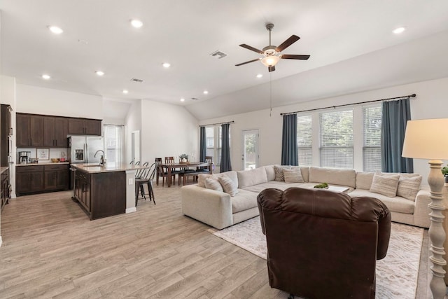 232 Silver Pass, Kyle, TX 78640 - living room featuring light wood-style floors, ceiling fan, vaulted ceiling, and recessed lighting