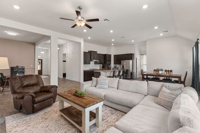 232 Silver Pass, Kyle, TX 78640 - living room with a ceiling fan, recessed lighting, vaulted ceiling, and light wood-style flooring
