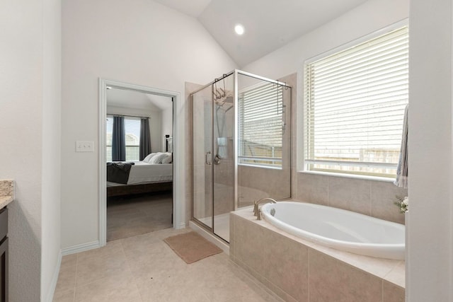 232 Silver Pass, Kyle, TX 78640 - ensuite bathroom featuring vanity, a garden tub, a stall shower, vaulted ceiling, and tile patterned floors