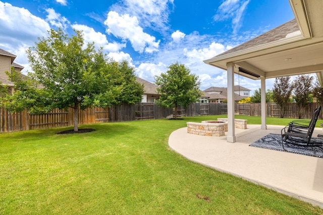 232 Silver Pass, Kyle, TX 78640 - fenced backyard with a patio and an outdoor fire pit