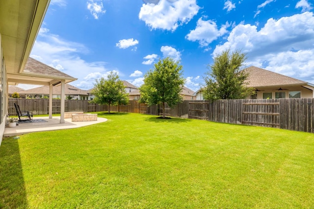 232 Silver Pass, Kyle, TX 78640 - fenced backyard featuring a patio, a ceiling fan, and a fire pit