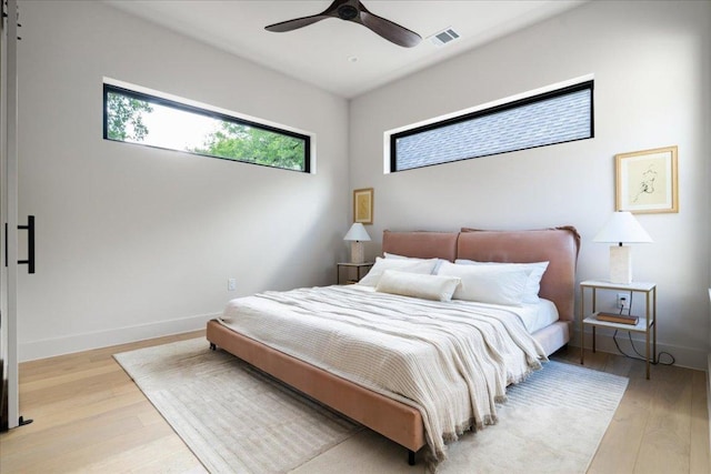 3003 W French Pl Unit 1, Austin, TX 78722 - bedroom with light wood finished floors and ceiling fan