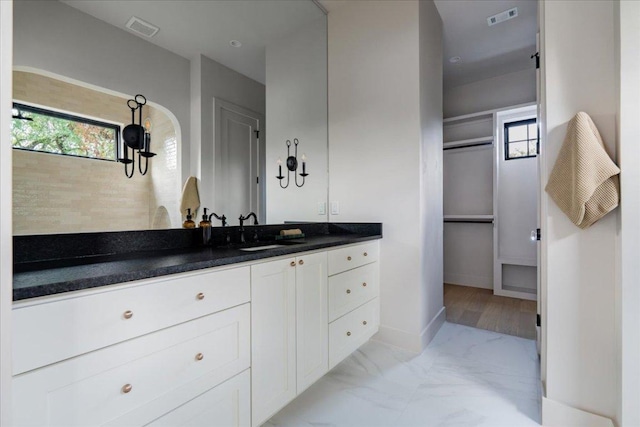 3003 W French Pl Unit 1, Austin, TX 78722 - bathroom with vanity and marble finish floors