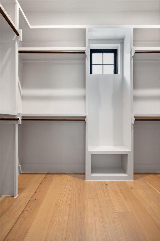 3003 W French Pl Unit 1, Austin, TX 78722 - walk in closet with wood finished floors