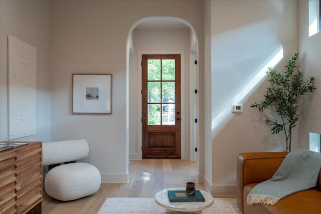 3003 W French Pl Unit 1, Austin, TX 78722 - doorway to outside with light wood-type flooring and arched walkways