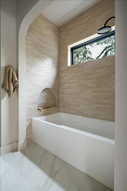 3003 W French Pl Unit 1, Austin, TX 78722 - full bathroom featuring a garden tub and marble finish flooring
