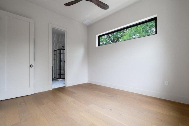3003 W French Pl Unit 1, Austin, TX 78722 - unfurnished bedroom with light wood finished floors and ceiling fan