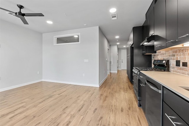 4510 Terry-O Ln Unit 205, Austin, TX 78745 - kitchen featuring appliances with stainless steel finishes, dark cabinetry, a ceiling fan, decorative backsplash, and light wood-style floors