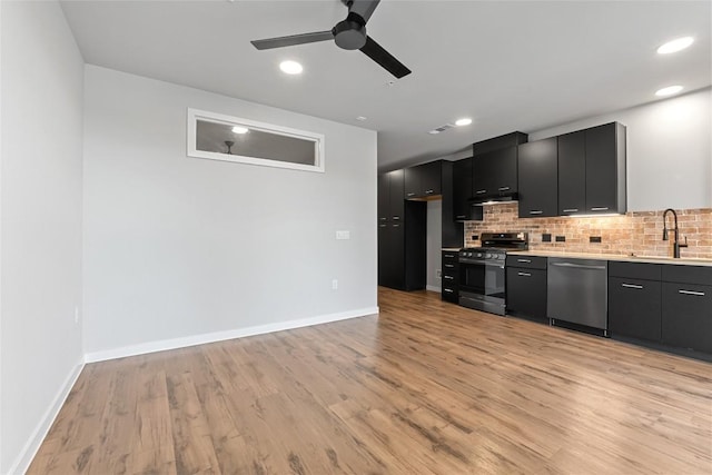 4510 Terry-O Ln Unit 205, Austin, TX 78745 - kitchen with stainless steel dishwasher, range, dark cabinets, a ceiling fan, and tasteful backsplash