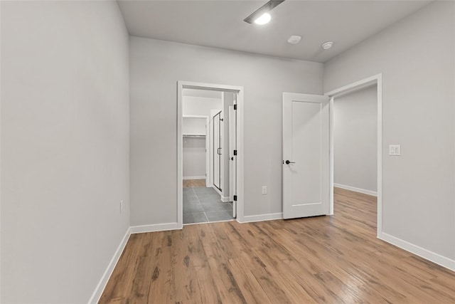 4510 Terry-O Ln Unit 205, Austin, TX 78745 - unfurnished bedroom featuring a spacious closet and wood finished floors