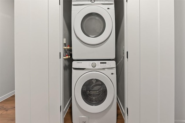 4510 Terry-O Ln Unit 205, Austin, TX 78745 - washroom with stacked washer / dryer and dark wood finished floors