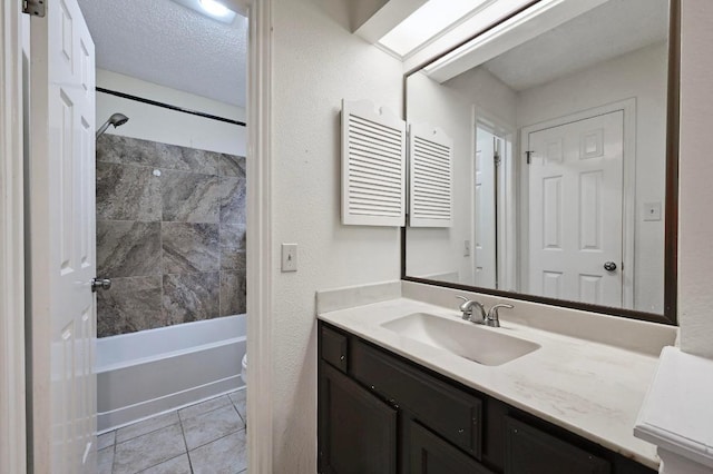 3111 Tom Green St Unit 203, Austin, TX 78705 - bathroom with vanity, washtub / shower combination, and tile patterned floors