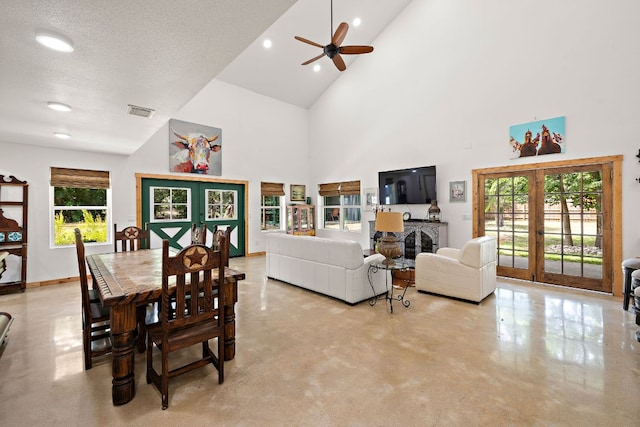 705 Peregrine Way, Leander, TX 78641 - dining area with french doors, high vaulted ceiling, concrete flooring, ceiling fan, and recessed lighting