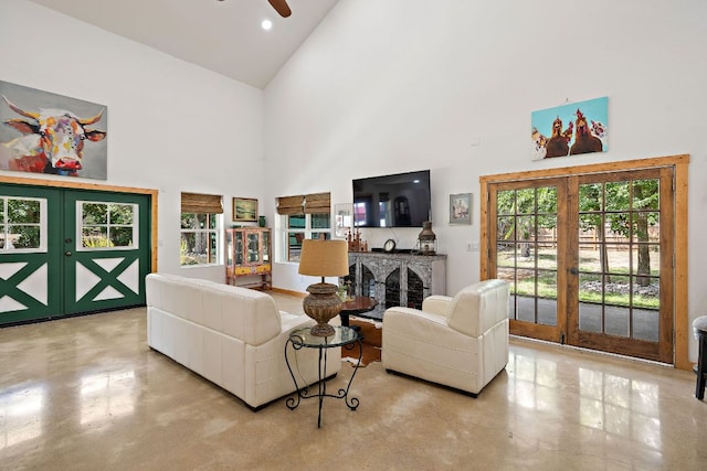 705 Peregrine Way, Leander, TX 78641 - living room featuring high vaulted ceiling, french doors, a ceiling fan, concrete flooring, and recessed lighting