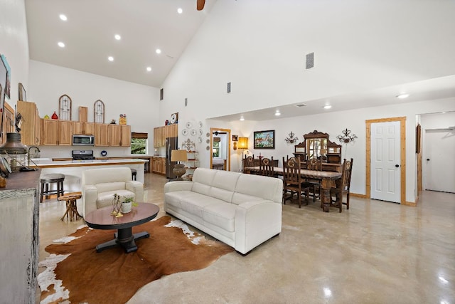 705 Peregrine Way, Leander, TX 78641 - living room with high vaulted ceiling, recessed lighting, and finished concrete floors