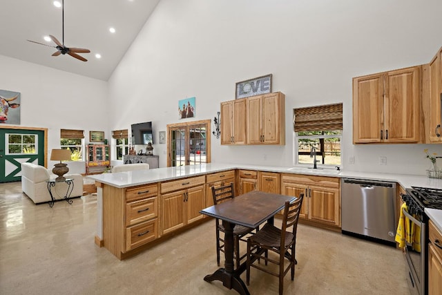 705 Peregrine Way, Leander, TX 78641 - kitchen featuring appliances with stainless steel finishes, high vaulted ceiling, a ceiling fan, a peninsula, and light countertops