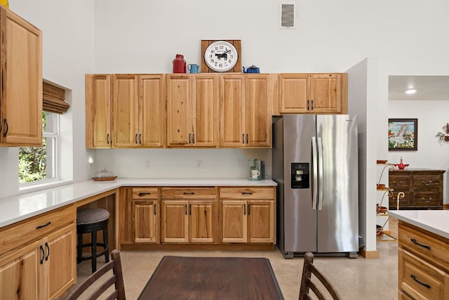 705 Peregrine Way, Leander, TX 78641 - kitchen featuring stainless steel fridge and light countertops