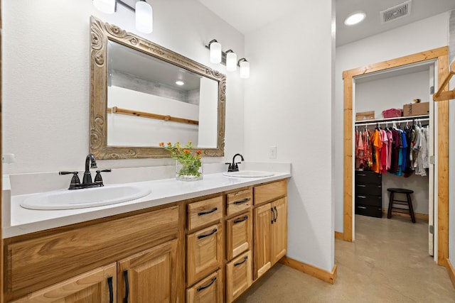 705 Peregrine Way, Leander, TX 78641 - full bathroom with double vanity and a walk in closet