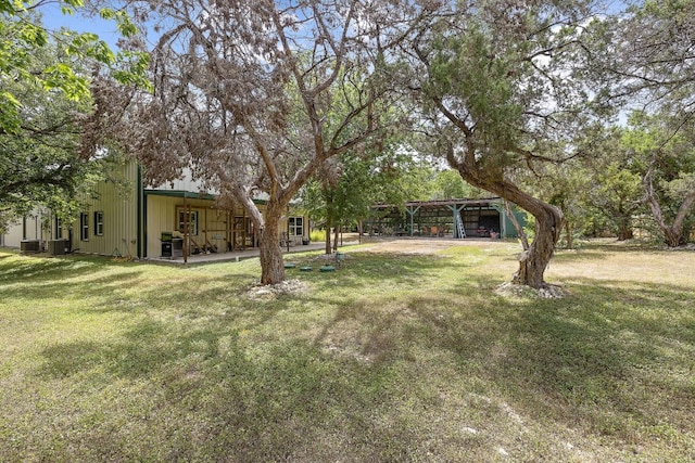 705 Peregrine Way, Leander, TX 78641 - view of green lawn featuring a carport