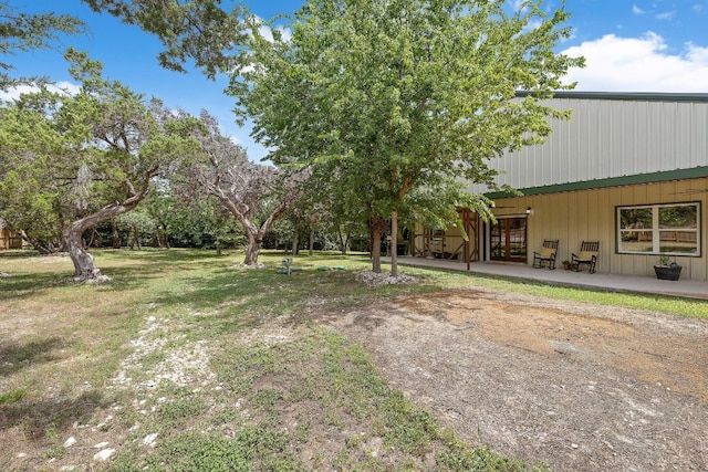 705 Peregrine Way, Leander, TX 78641 - view of green lawn featuring a patio