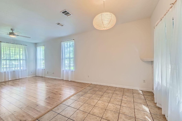 2920 Thrushwood Dr, Austin, TX 78757 - empty room with ceiling fan and light tile patterned flooring