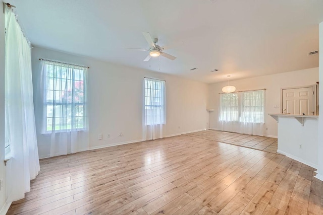 2920 Thrushwood Dr, Austin, TX 78757 - spare room with a ceiling fan and light wood finished floors
