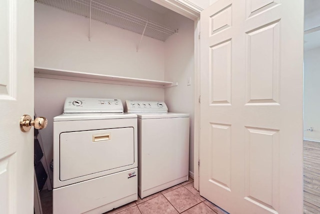2920 Thrushwood Dr, Austin, TX 78757 - washroom featuring independent washer and dryer and light tile patterned floors