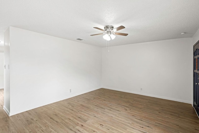 3050 Beacon Fld, San Antonio, TX 78245 - spare room with ceiling fan, a textured ceiling, and light wood-style floors