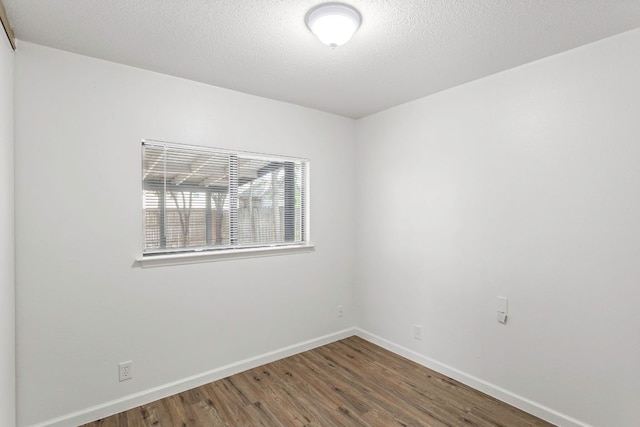 3050 Beacon Fld, San Antonio, TX 78245 - empty room featuring wood finished floors and a textured ceiling