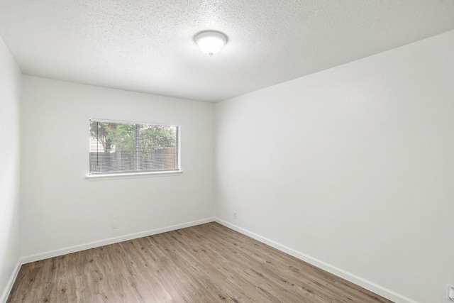3050 Beacon Fld, San Antonio, TX 78245 - spare room with light wood finished floors and a textured ceiling